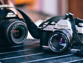 black Canon and Nikon camera in macro shot photography